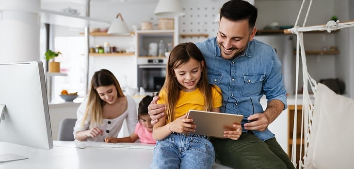 Online school, technology, family concept. Happy parents helping to children to study at home